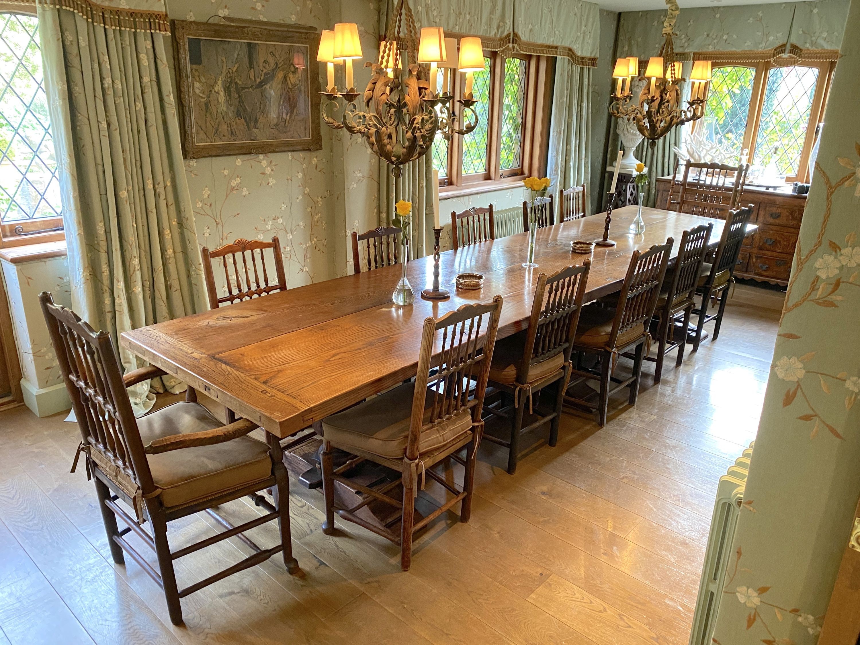 An impressively large 17th century style oak refectory table, with twin plank top on triple baluster supports and trestle foot, width 430cm depth 99cm height 74cm